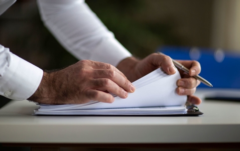 man going through papers